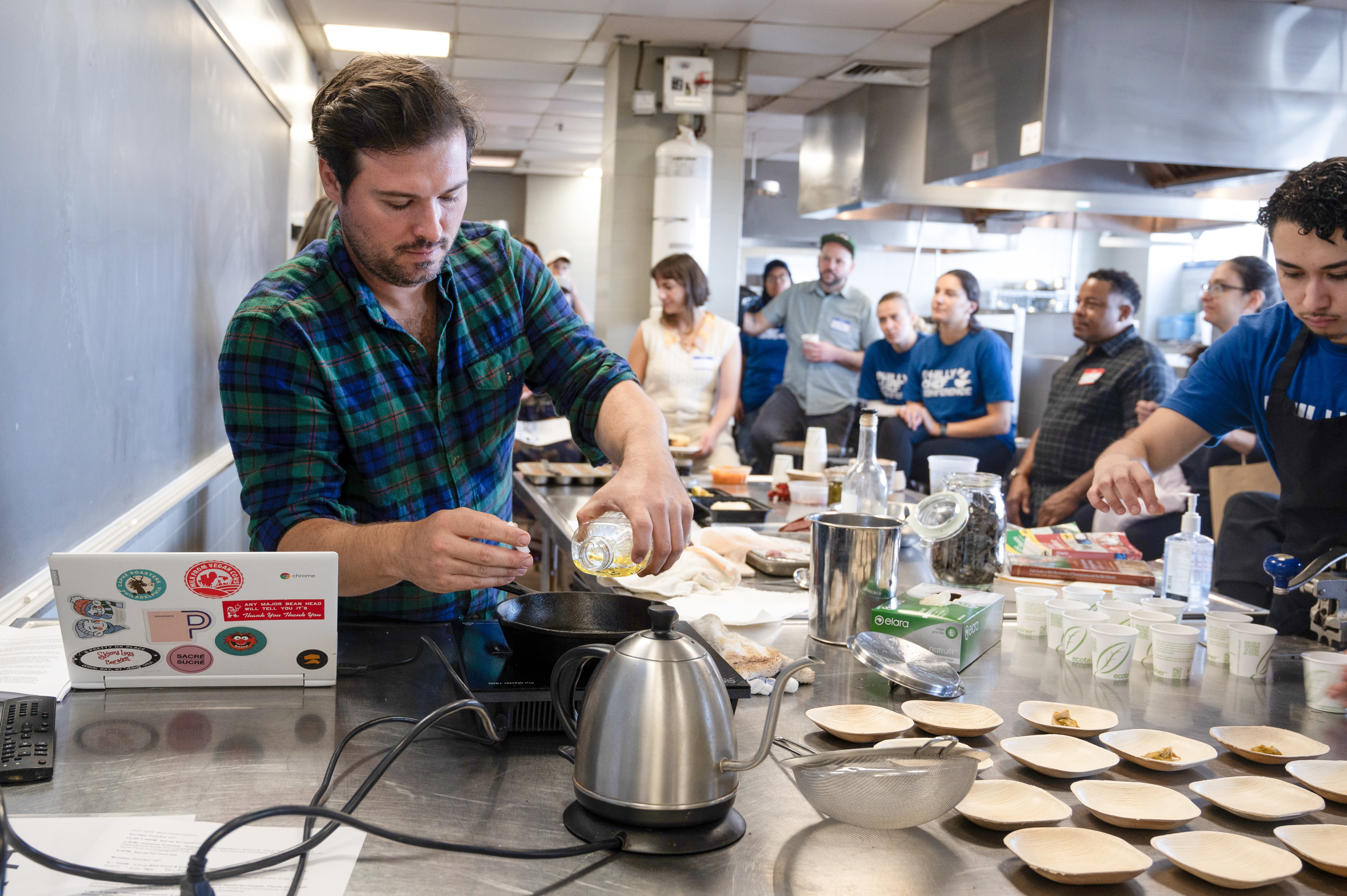 Man does cooking demonstration with students
